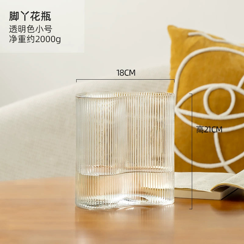 Small and niche transparent flower vase with feet